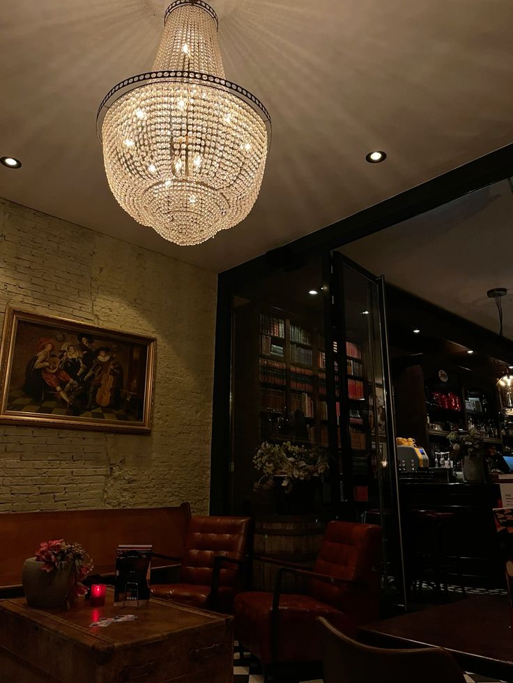 A bar room with chandelier hanging